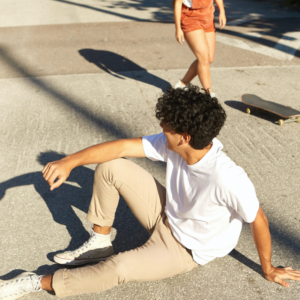 A guy enjoys in sunny, skateboarding day