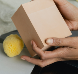 Image showing hands holding and unboxing a box.